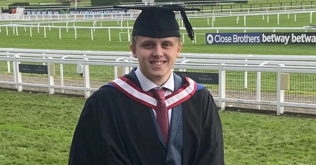 Skydiver Benedict in his cap and gown