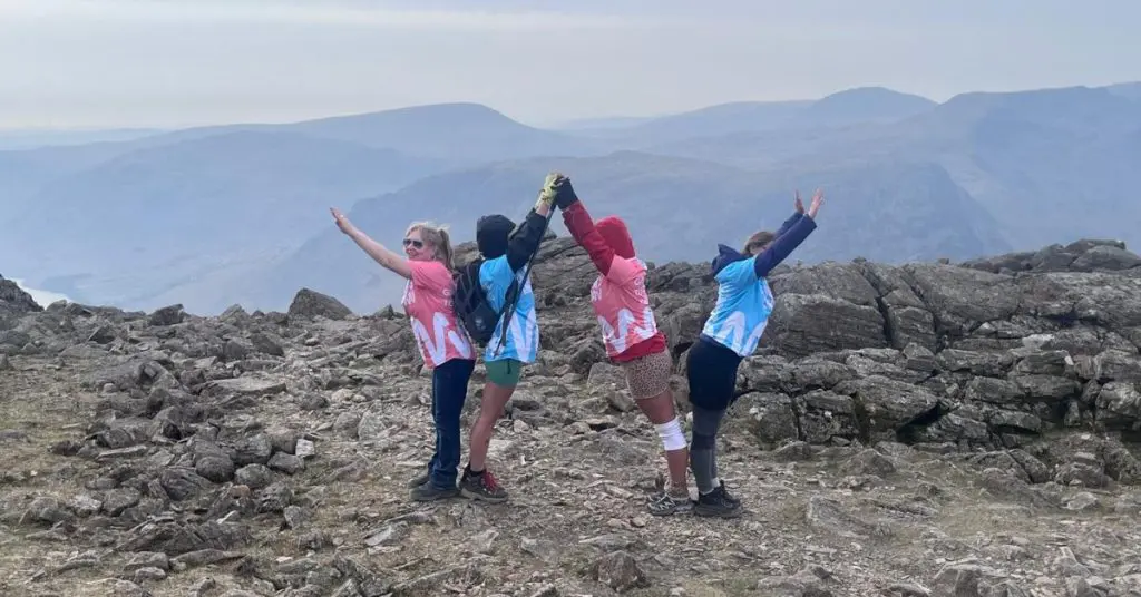 From left: Daisy (step mum), Matilda, Keturah (friend), Melody (mum) creating a 'W' during Three Peaks Challenge