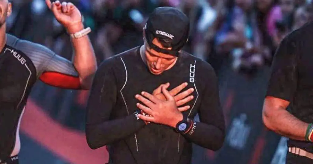 Peter McGahan-Boyd at the end of his Ironman Challenge looking relieved and happy