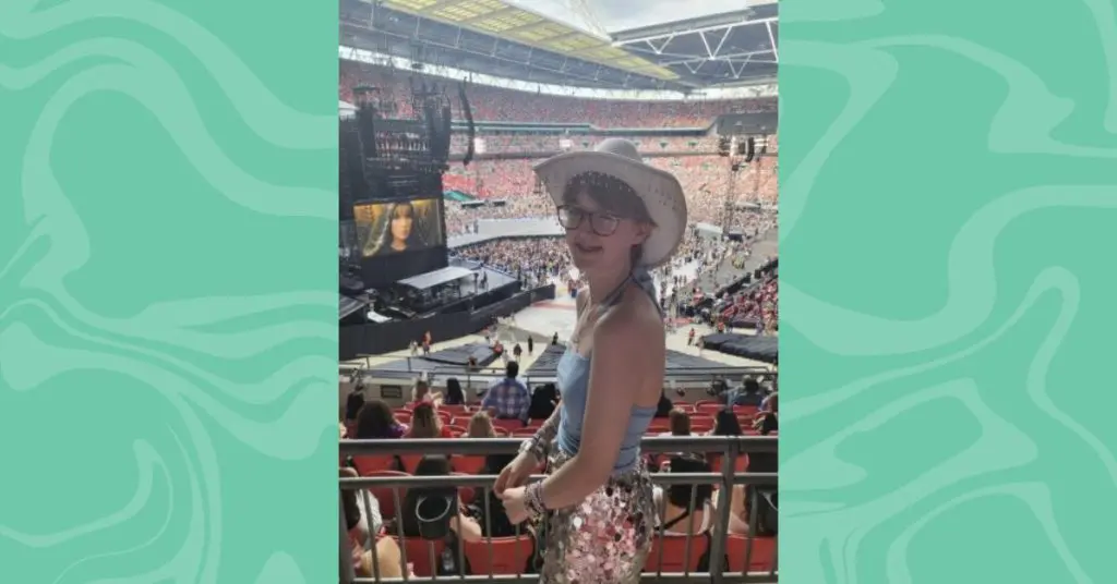 Youth Ambassador Toby at a Taylor Swift concert smiling at the camera