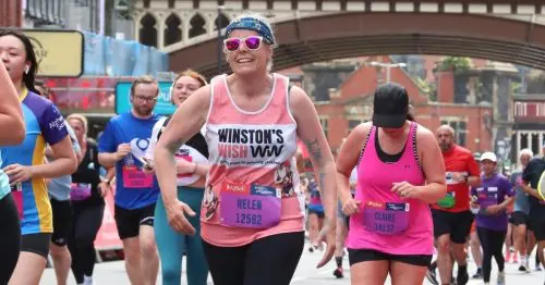 Helen running Manchester Marathon in her Winston's Wish vest