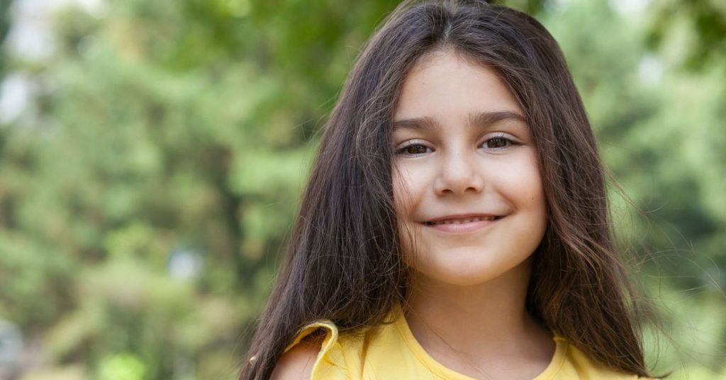Small child smiling at the camera
