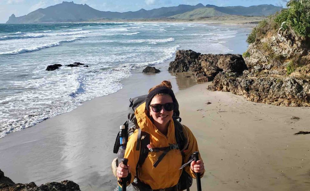 Oversea trekker, Charlotte on the beach in New Zealand.