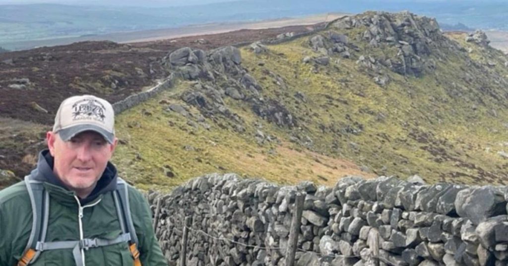 George during his 65-mile walking challenge in the countryside