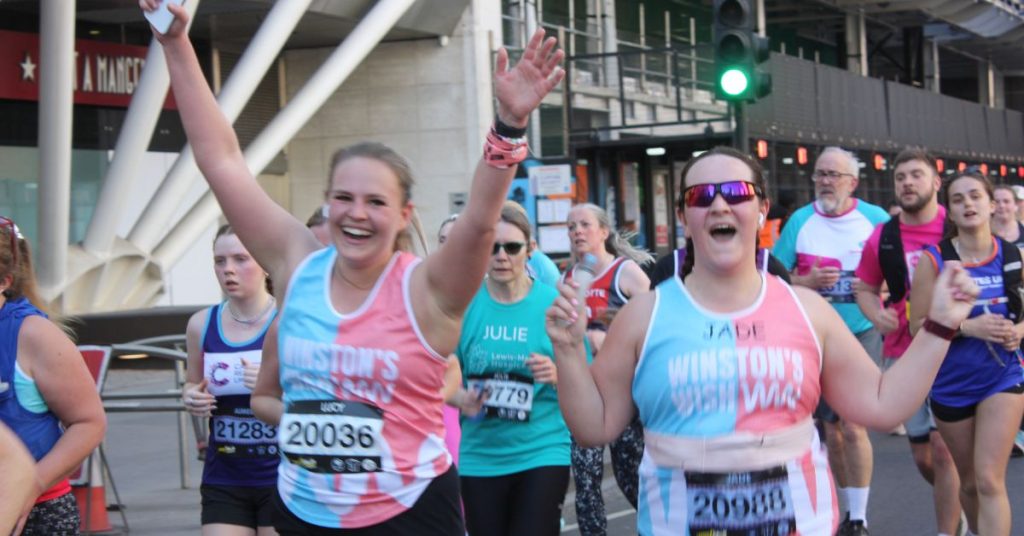 Winston's Wish runners mid race cheering on their success