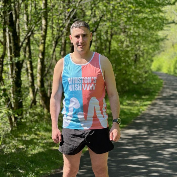 Gareth Evans in a park wearing a Winston's Wish running vest