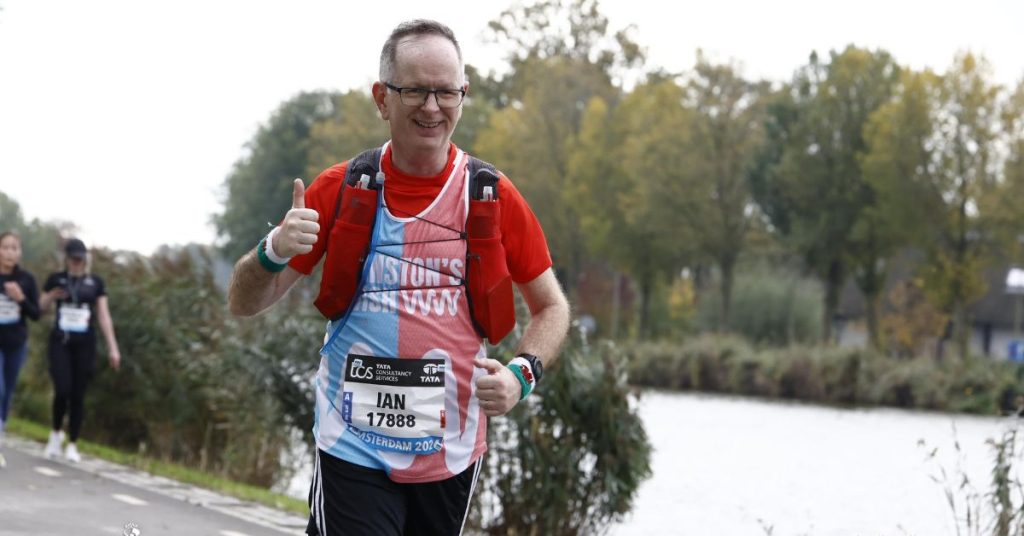 Ian running the Amsterdam Marathon wearing a Winston's Wish running vest