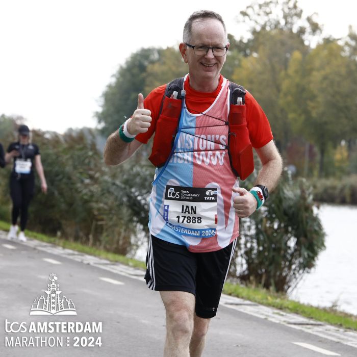 Ian running the Amsterdam Marathon challenge in a Winston's Wish running vest