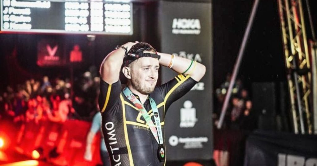 James at the finish line of the Wales Ironman Challenge, completed in 2022