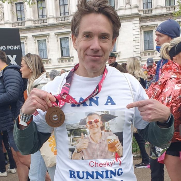 Ian with his London Marathon medal, wearing his personalised t-shirt, dedicated to his friend Russell