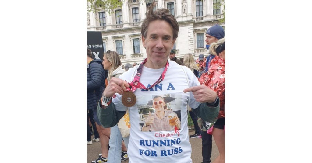 Ian with his London Marathon medal, wearing his personalised t-shirt, dedicated to his friend Russell