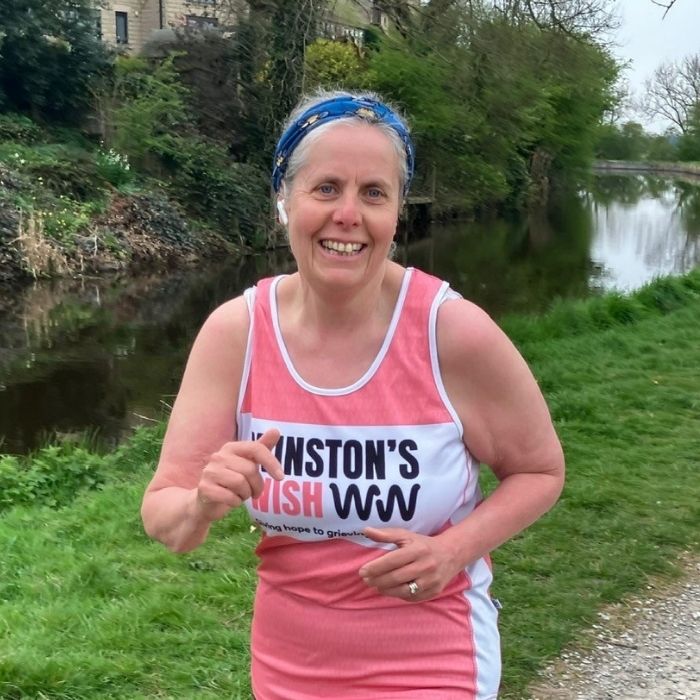 Helen running, wearing a Winston's Wish vest